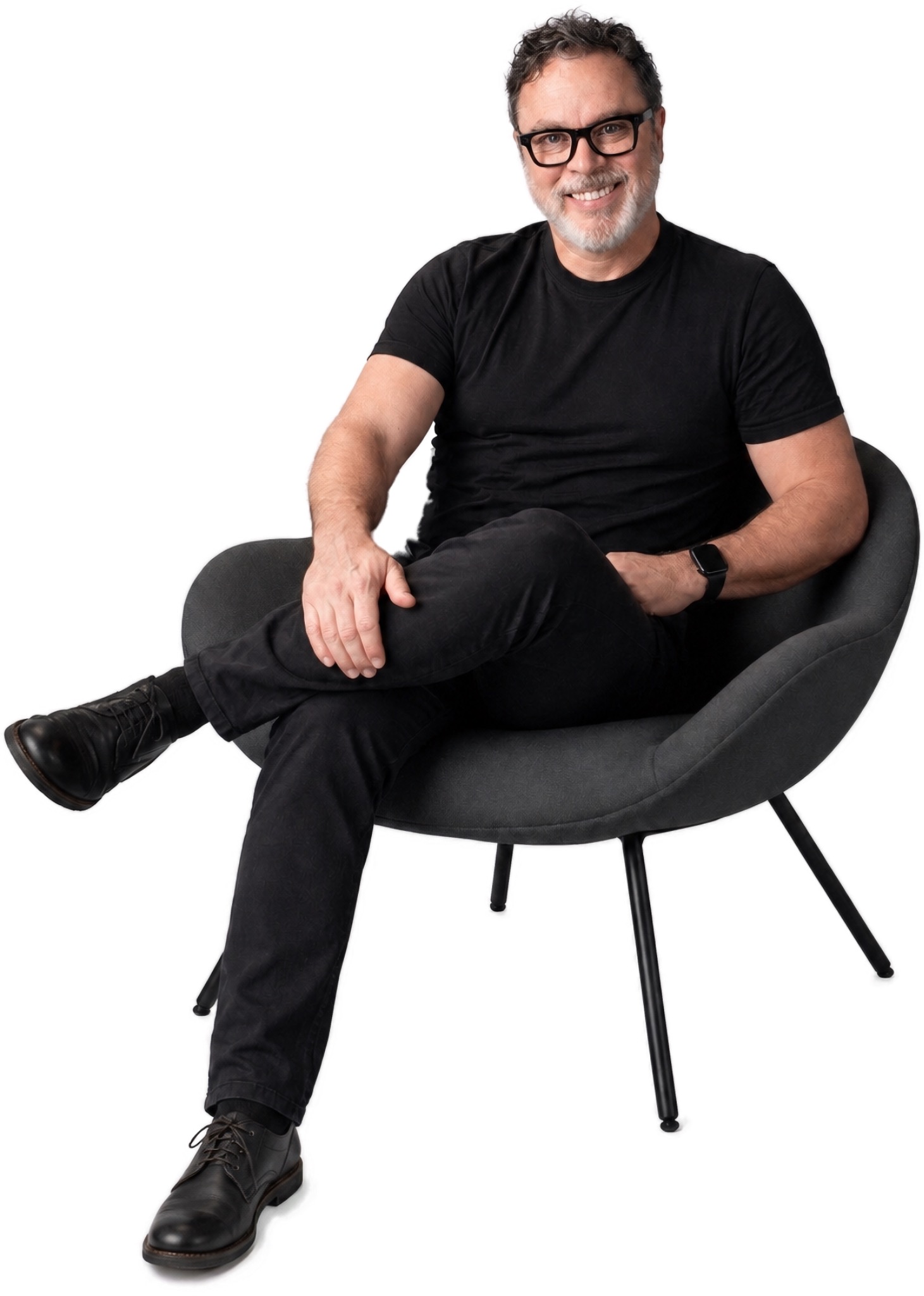 James seated in a modern chair